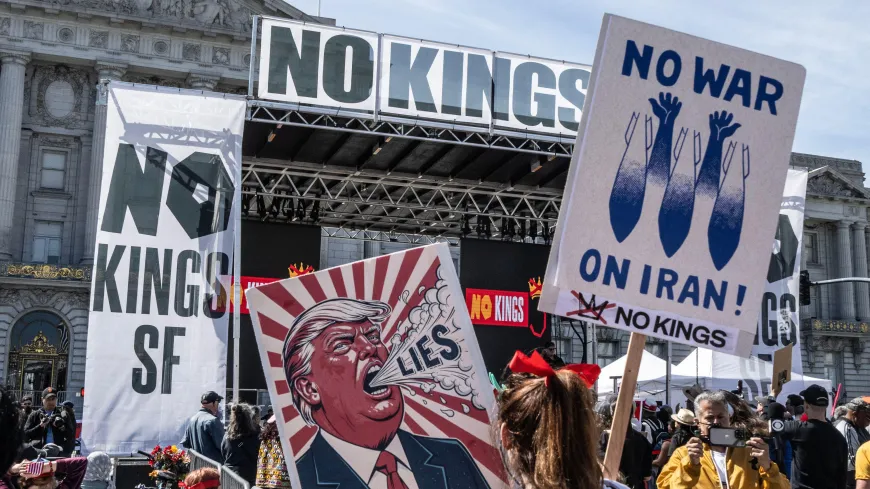 San Francisco, United States. 28th Mar, 2026. Demonstrators walk with signs around the Civic Center of San Francisco on Saturday, March 28, 2026.