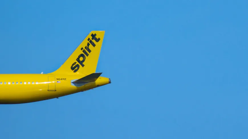Partial view of Spirit Airlines airplane at Orlando International Airport area.