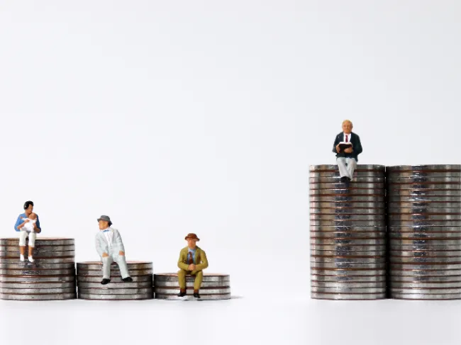 figurines on different coin stacks