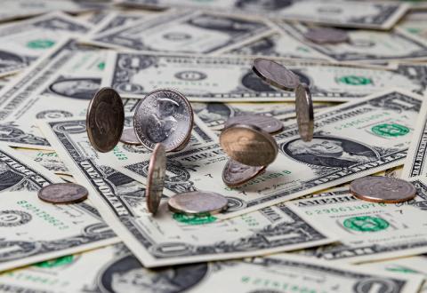 coins on pile of cash